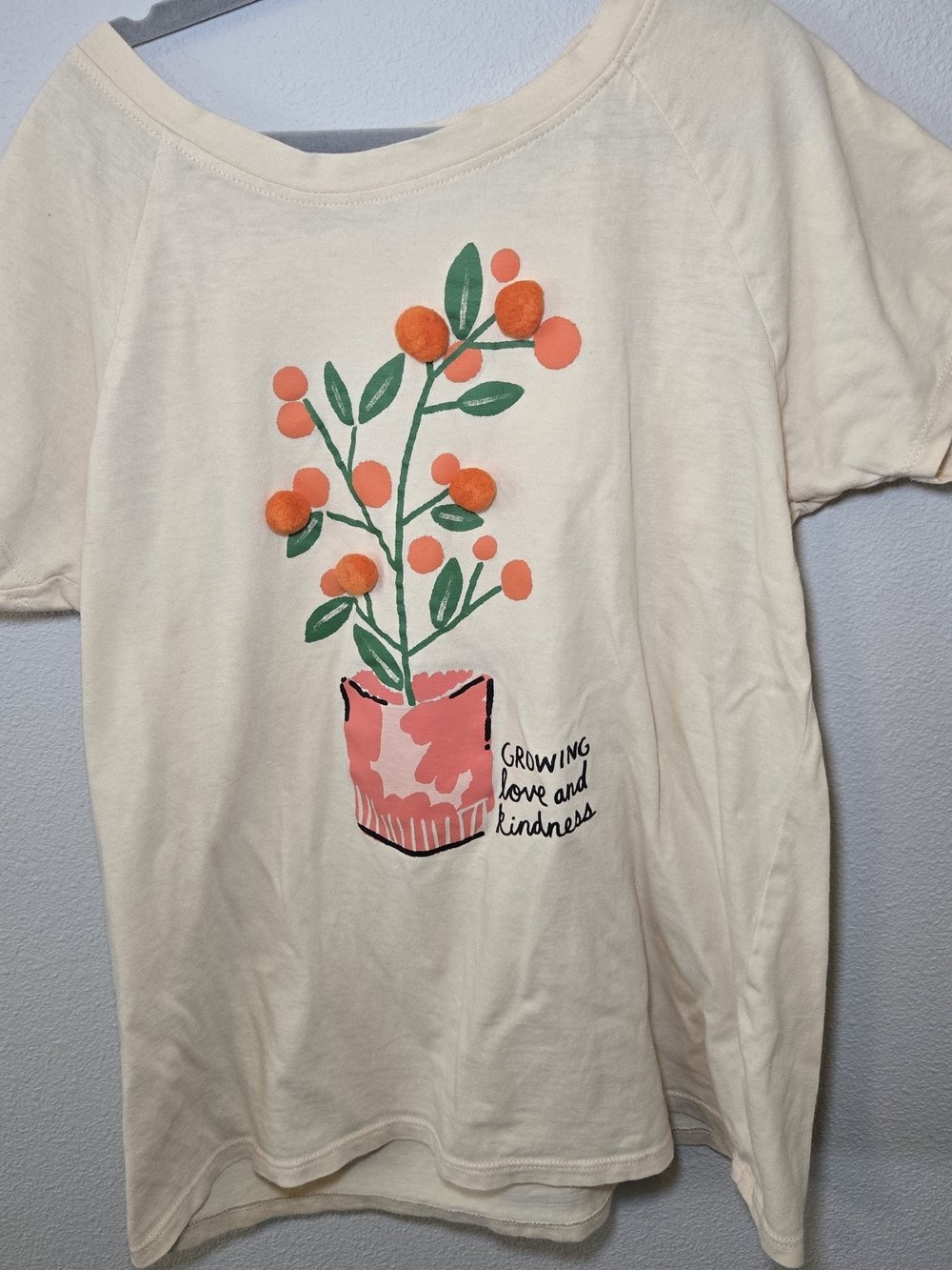 dip Cream Tee with Orange Pom-Pom Plant Graphic